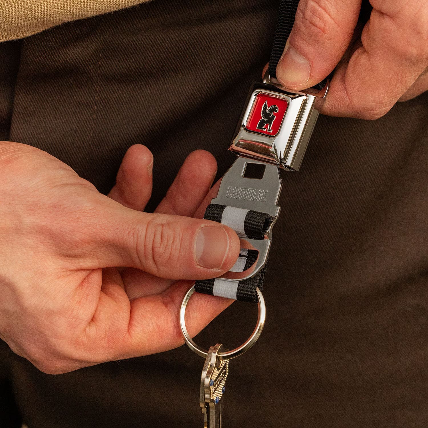 Mini Buckle Keychain on a guy's belt loop