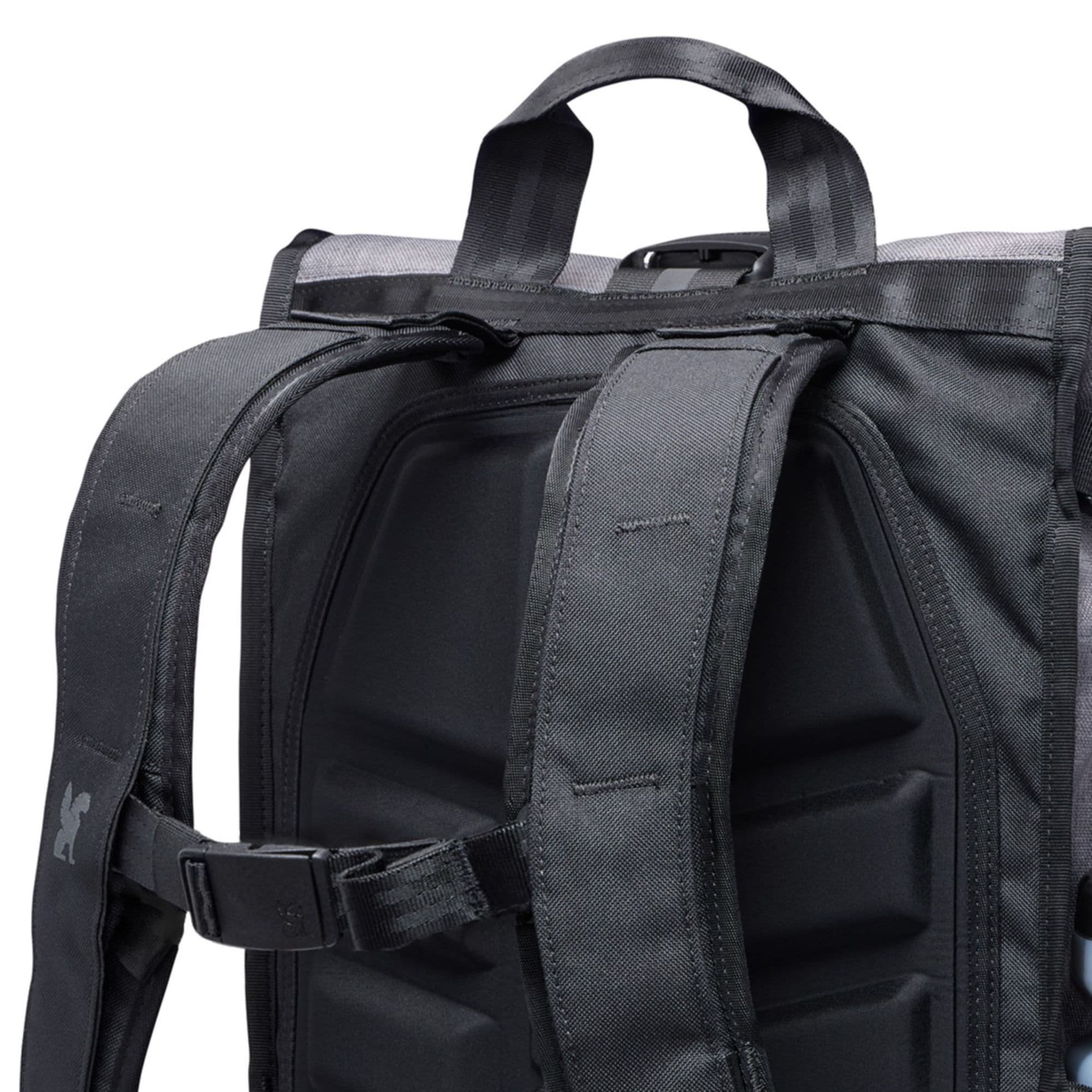 Close-up of a grey Barrage 18L backpack with straps and a chrome logo #color_castlerock twill