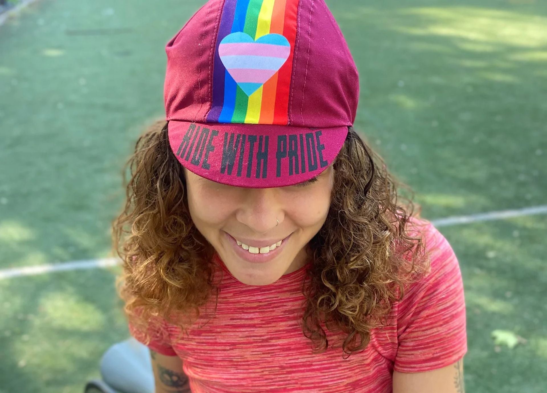 Woman wearing a pride hat from 2021